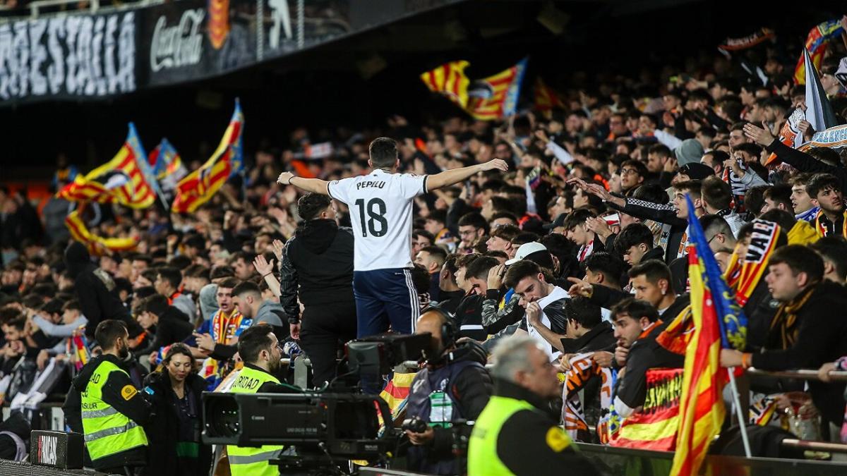 Valencia fans wave their flags ahead of La Liga game
